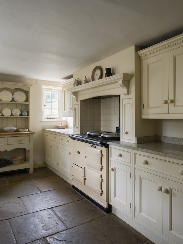 Cream in-frame traditional kitchen with range cooker in an Ingatestone cottage
